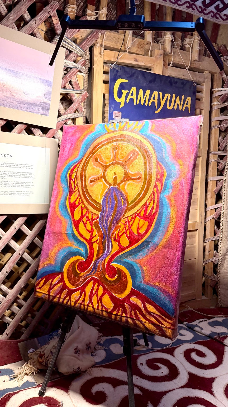 Tengri’s Golden Tree on the easel inside the Tengri Camp yurt at Burning Man 2026